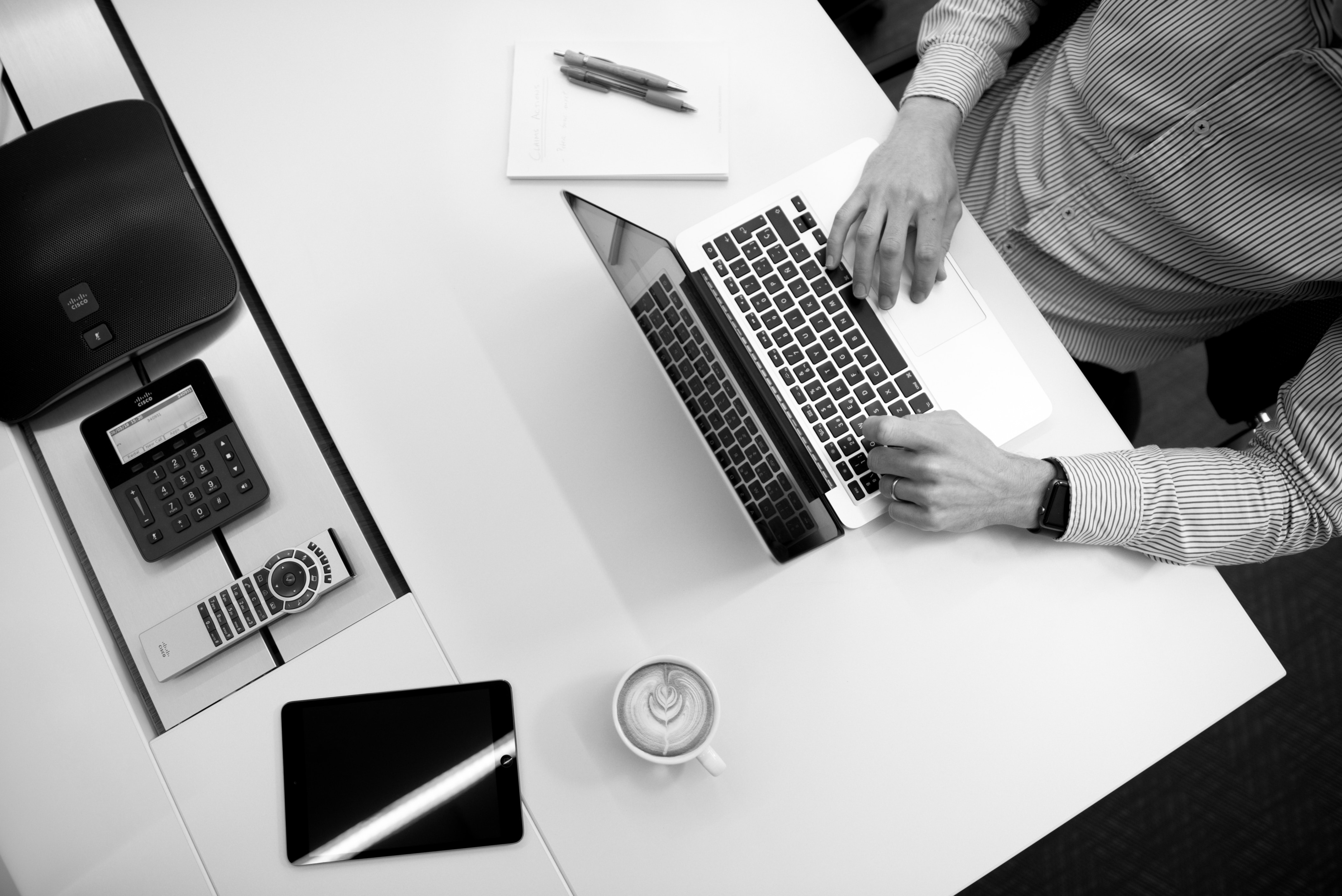 A woman walking on an arrow graph and a man sitting on a circle diagram working on a computer